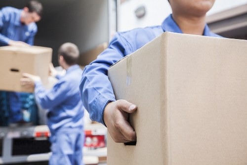 Movers handling boxes carefully during a safe home removal