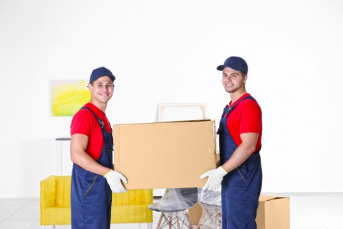 Furniture and boxes being moved with a local removals van