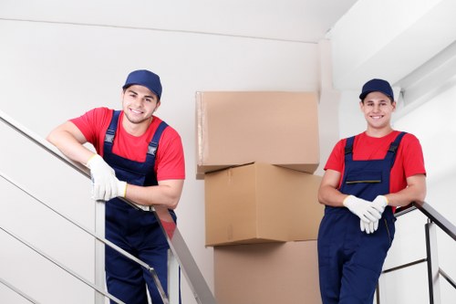 Team using safe lifting techniques during a move