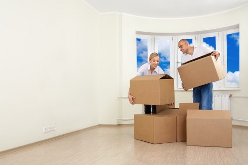 Trained removal staff securing furniture inside a van