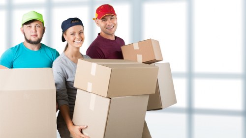 Loading household items into a removal truck